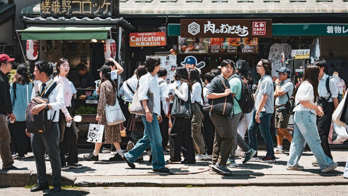 Crowded street in Kyoto showcasing vibrant daily life and culture.