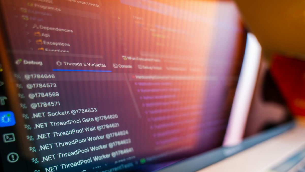 Focused view of a computer screen displaying code and debug information.