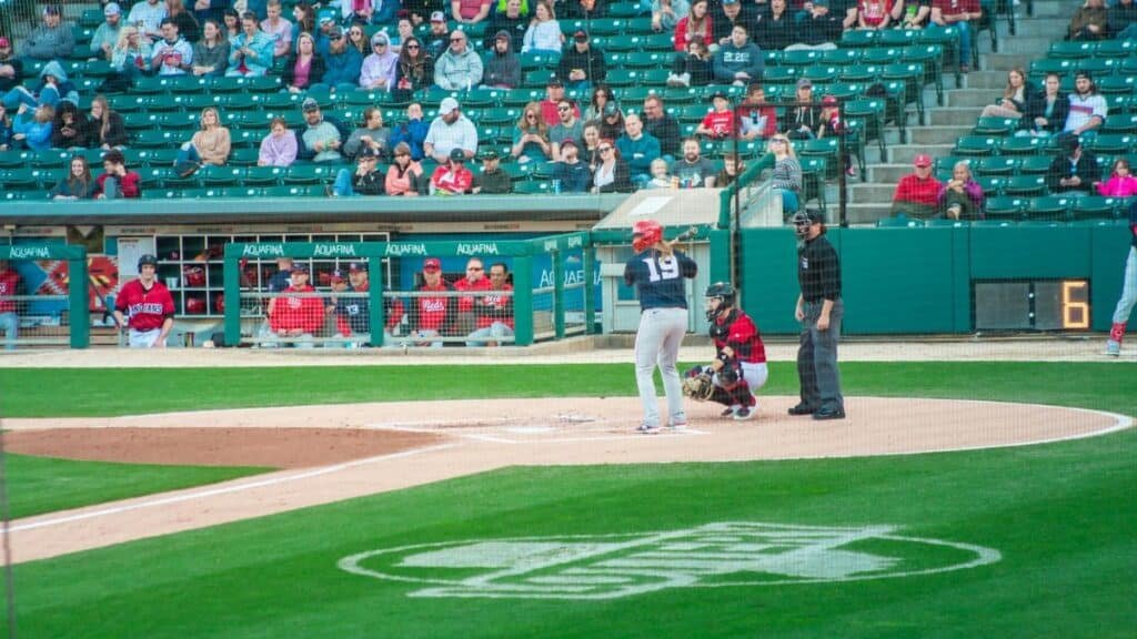 A thrilling baseball game at Victory Field, Indianapolis with players and crowd engaged.