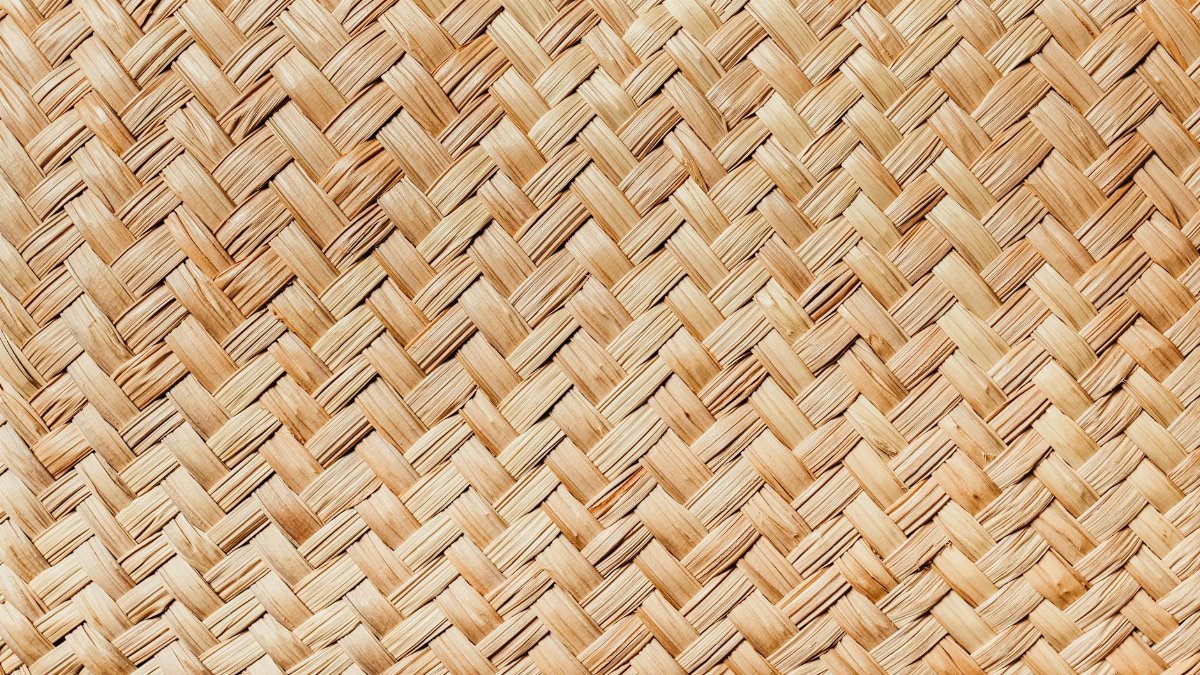 Close-up of a detailed woven straw texture, perfect for natural and organic design elements.
