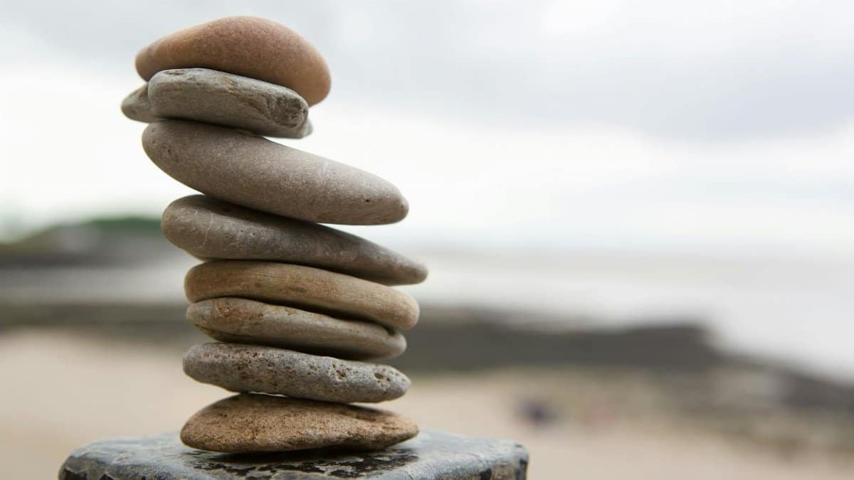 A serene composition of stacked stones on an English beach, symbolizing balance.