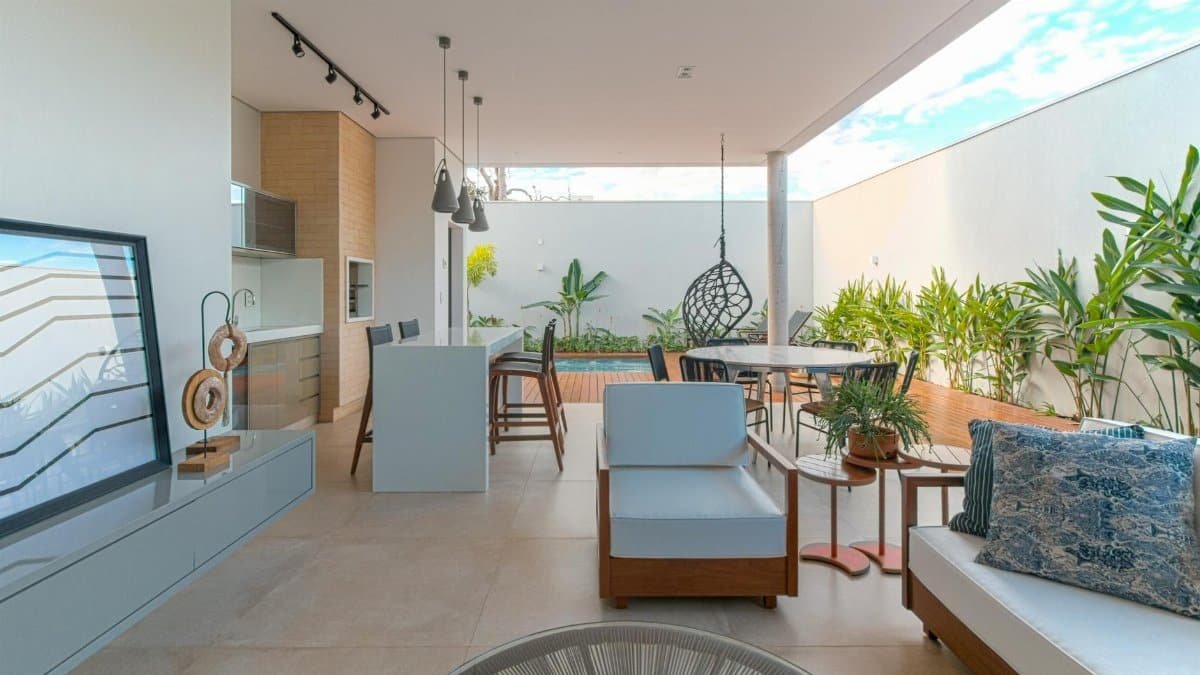 Stylish open-air veranda with chic furniture and lush plants.