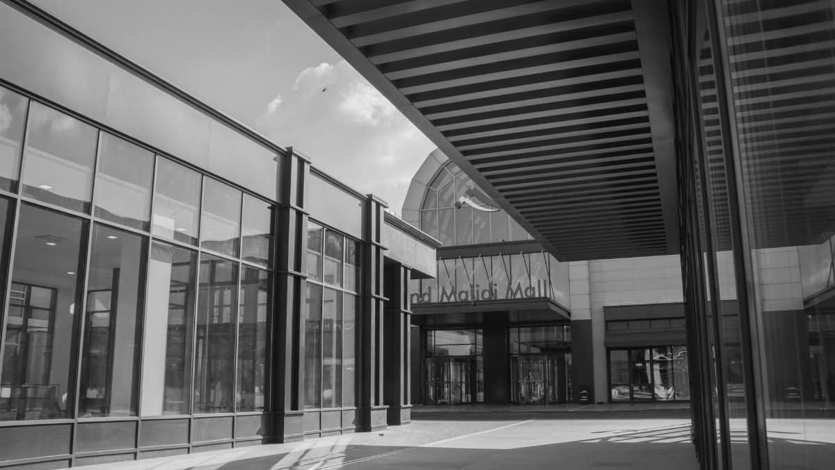 Modern architectural design of Grand Majidi Mall in black and white. Urban exterior facade.