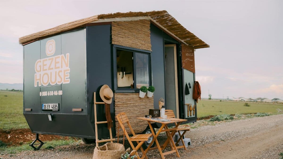 A charming tiny mobile home set in nature, perfect for travel and adventure.