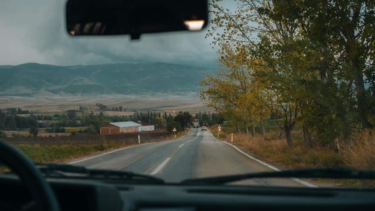 View through car windshield of scenic road in autumn, Merzifon, Türkiye.