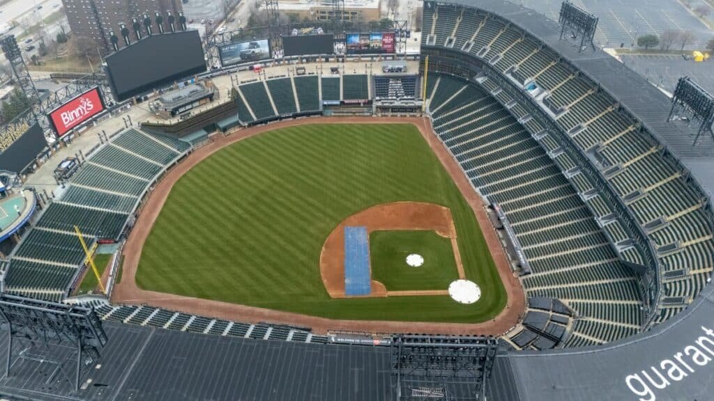 Empty Guaranteed Rate Field in Chicago captured from above, showcasing the lush green baseball field and seating areas.