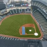 Empty Guaranteed Rate Field in Chicago captured from above, showcasing the lush green baseball field and seating areas.
