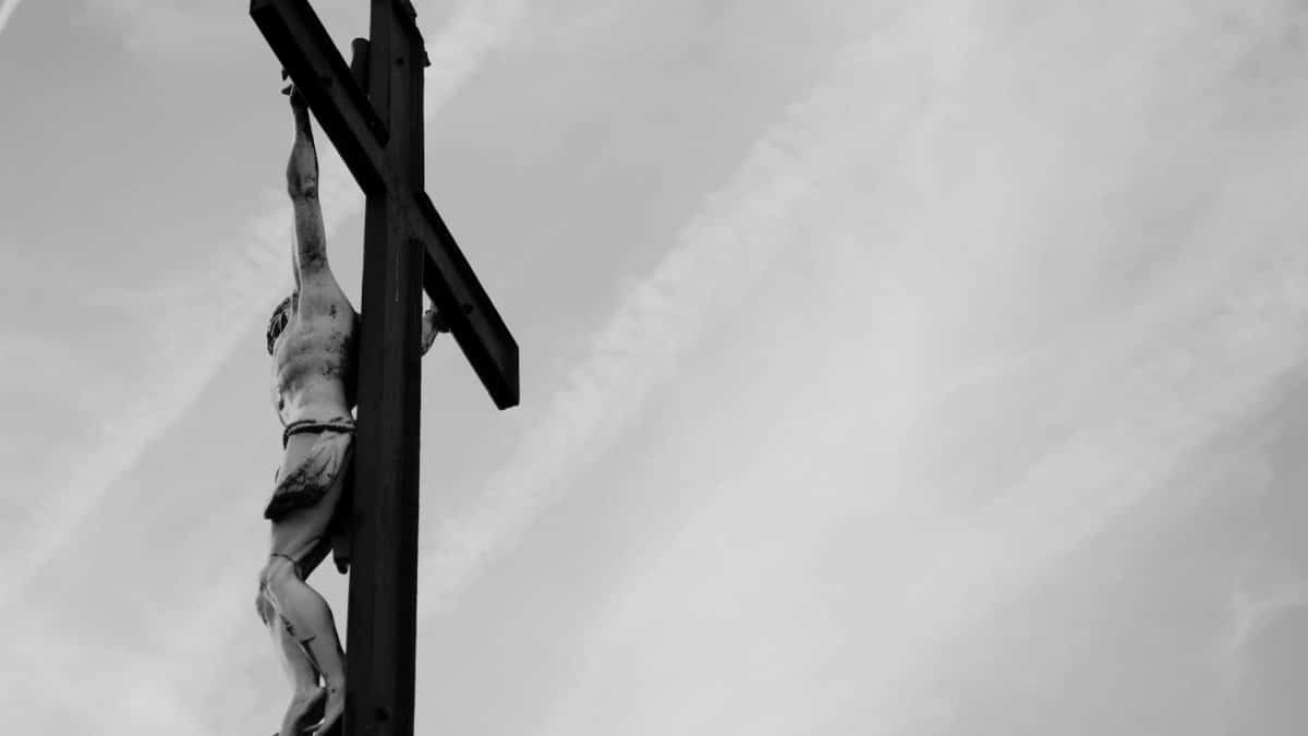 Dramatic black and white photo of Jesus Christ's crucifixion capturing religious symbolism.