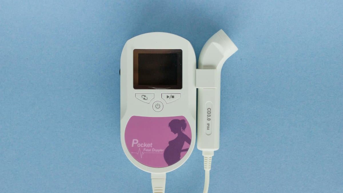 Close-up of a handheld Doppler fetal monitor used for prenatal care.