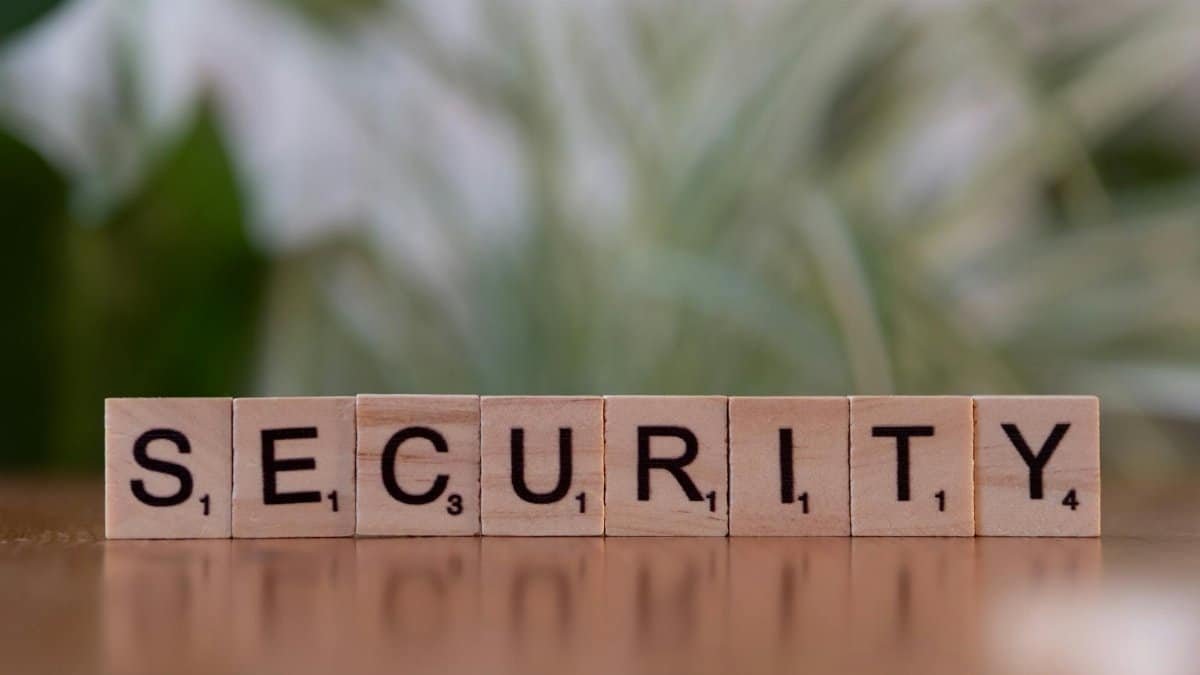 Close-up of wooden Scrabble tiles spelling SECURITY, symbolizing cybersecurity and protection.