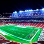 A panoramic night view of Levi's Stadium in Santa Clara, highlighting vibrant lights.