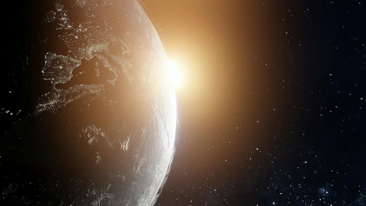 A stunning view of Earth at sunrise from space, highlighting cosmic beauty.