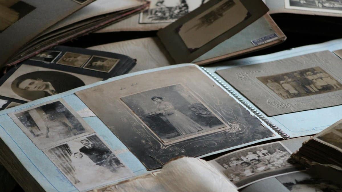 Explore vintage family photo albums filled with black and white photographs, capturing timeless memories.