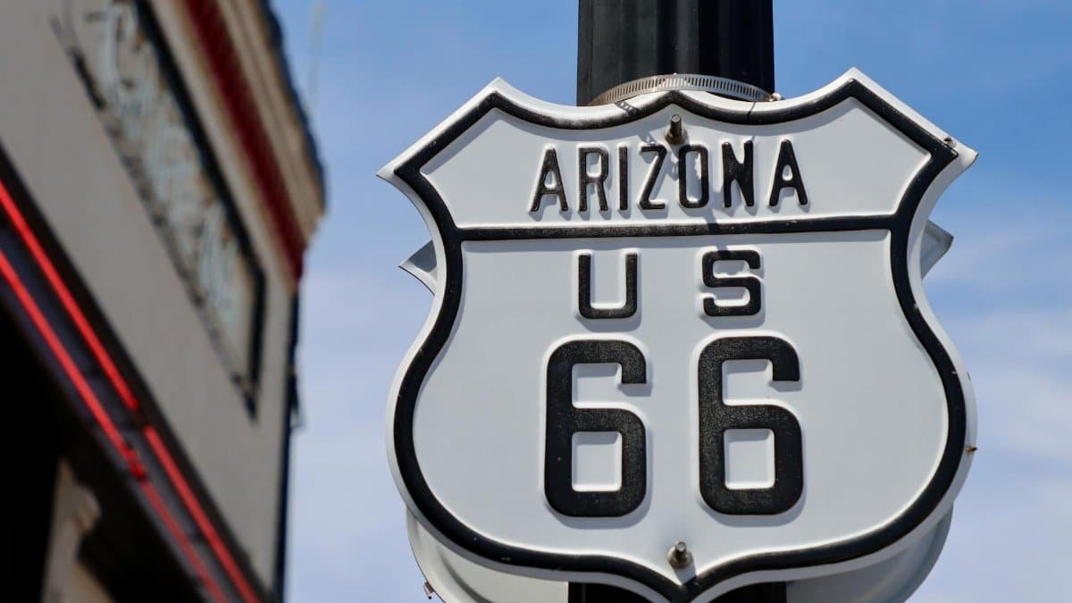 Close-up of the famous Route 66 sign in Arizona, symbolizing historic travel.