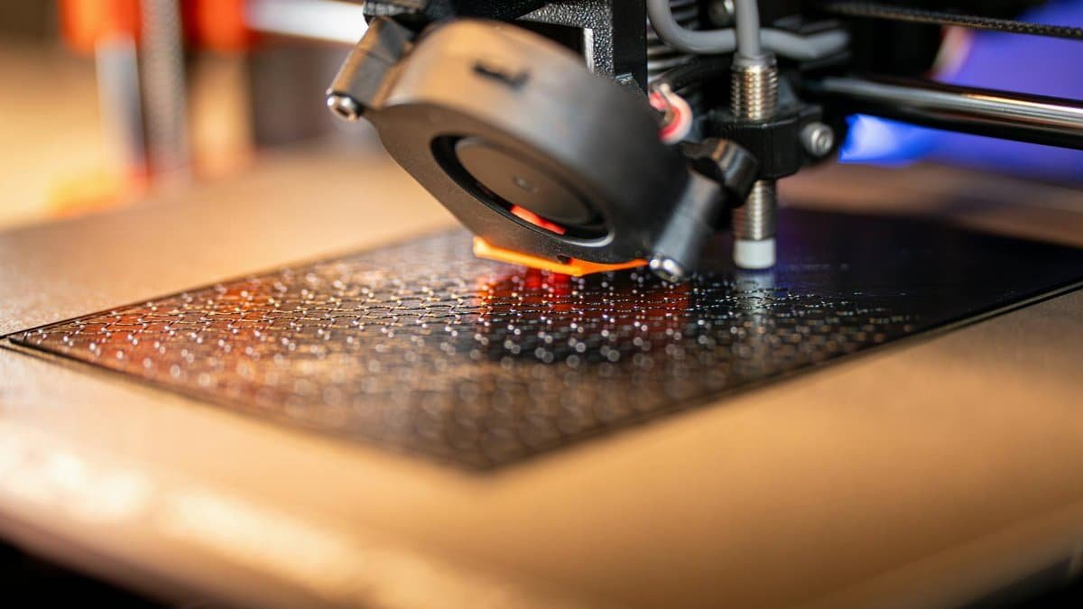 Detailed view of a 3D printer in action, showcasing cutting-edge manufacturing technology.