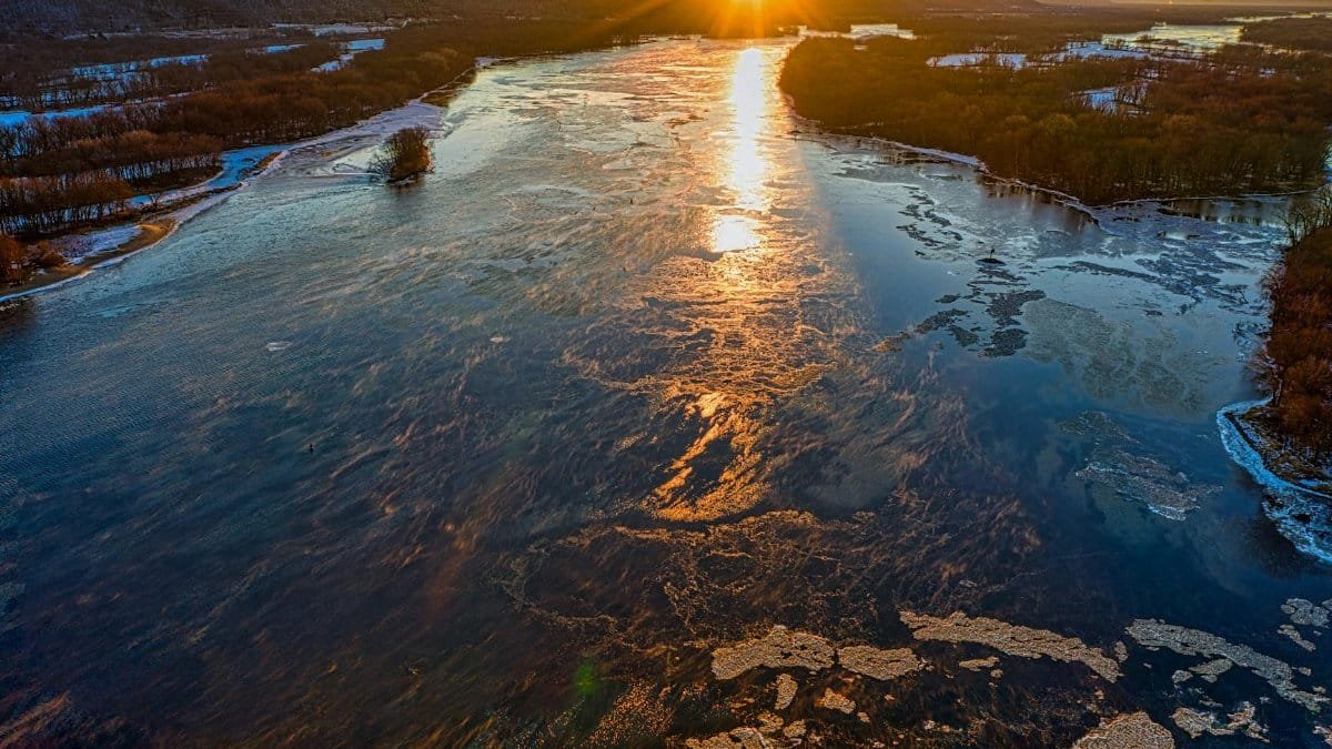 A breathtaking aerial view of the Mississippi River at sunset in West Newton, Minnesota.