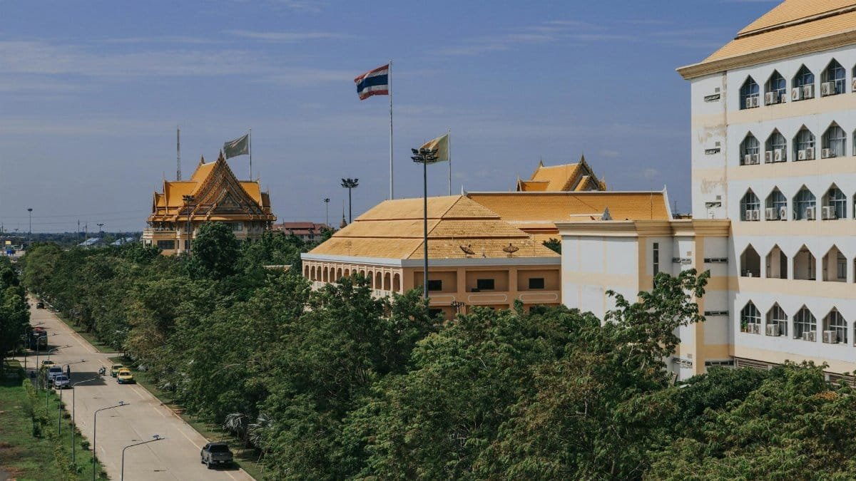 A scenic view of Ayutthaya university campus with golden roofs in Thailand, showcasing traditional architecture.