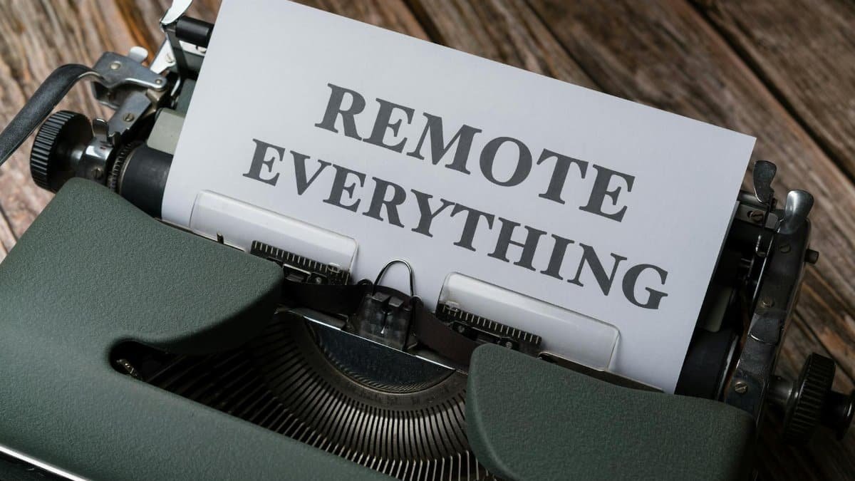 Old-fashioned typewriter with a paper showing the words 'Remote Everything', symbolizing remote work and virtual connectivity.