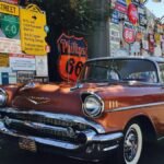 Classic Chevrolet car parked with Route 66 signage in Albuquerque, New Mexico. Nostalgic travel scene.