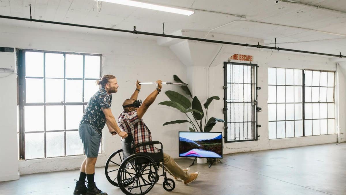 A diverse group engages in virtual reality indoors for rehabilitation and fun.