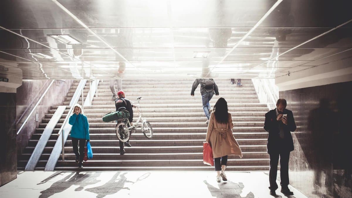 People walking through an underground passage in Moscow, showcasing urban daily life.
