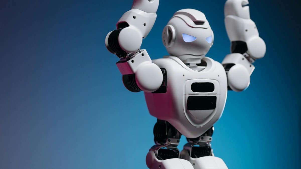 A white humanoid robot in a studio setting showcasing advanced robotics and modern technology.