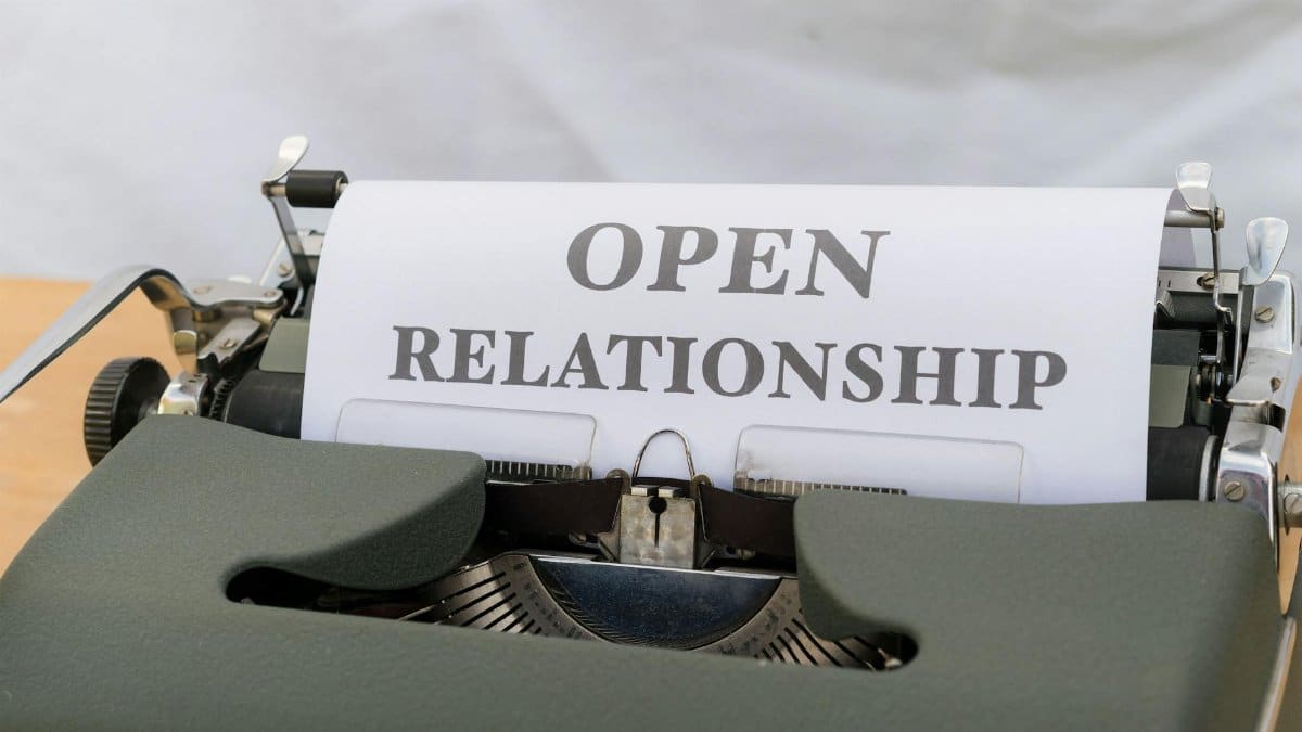 Vintage typewriter displaying the words 'Open Relationship' on paper.