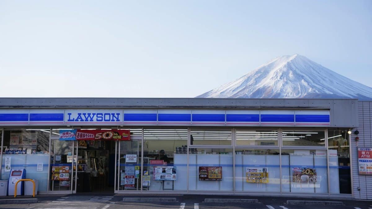 Lawson convenience store with Mount Fuji backdrop in Yamanashi, Japan, capturing serene rural lifestyle.