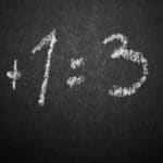 Chalkboard with a humorous incorrect math equation, ideal for educational settings.
