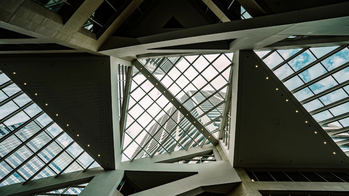 A striking view of a geometric glass atrium ceiling in Minneapolis, showcasing architectural design.