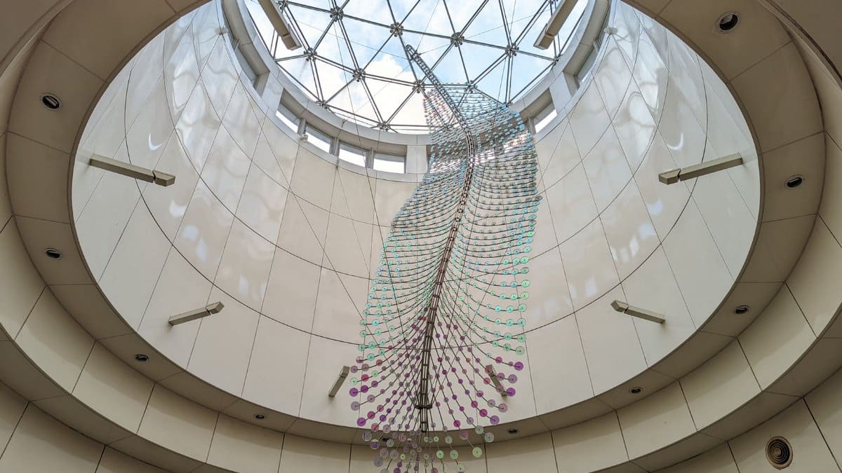 Ceiling view of intricate art installation with natural light at a subway station in New Taipei City, Taiwan.