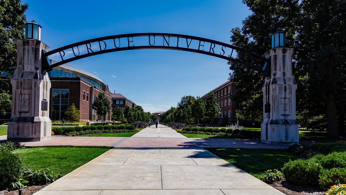 Scenic view of Purdue University's entrance arch with a clear blue sky.
