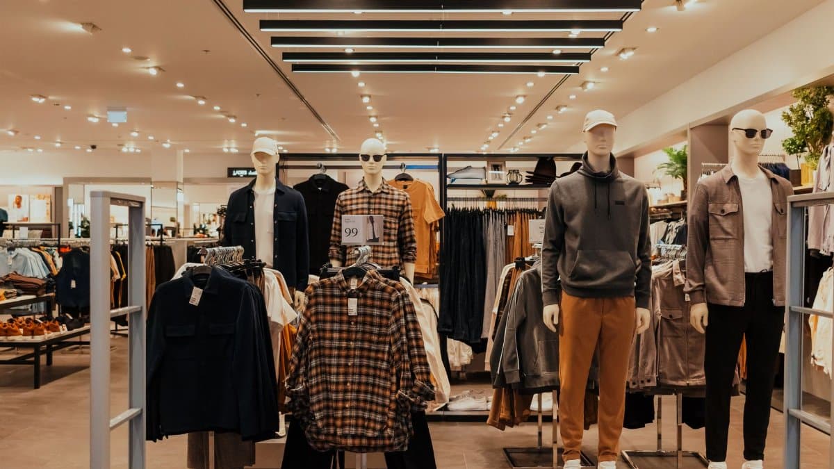 Stylish clothing display in a modern Dubai retail store, featuring mannequins.