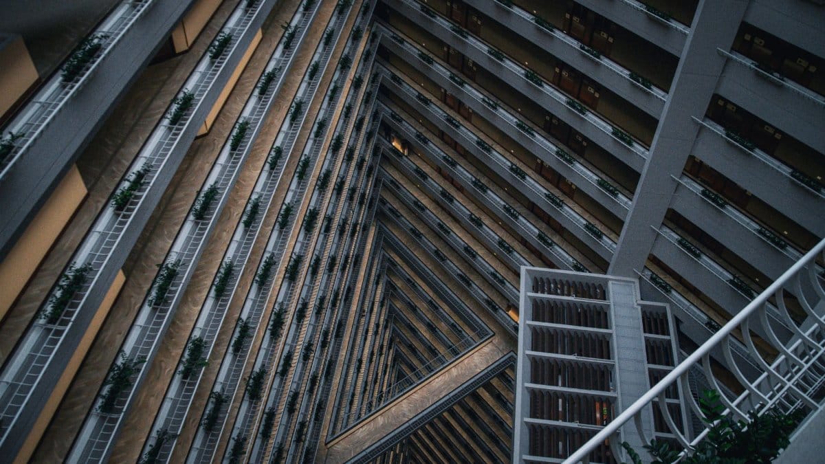 A striking geometric view of a modern building's interior, capturing architectural lines and depth.