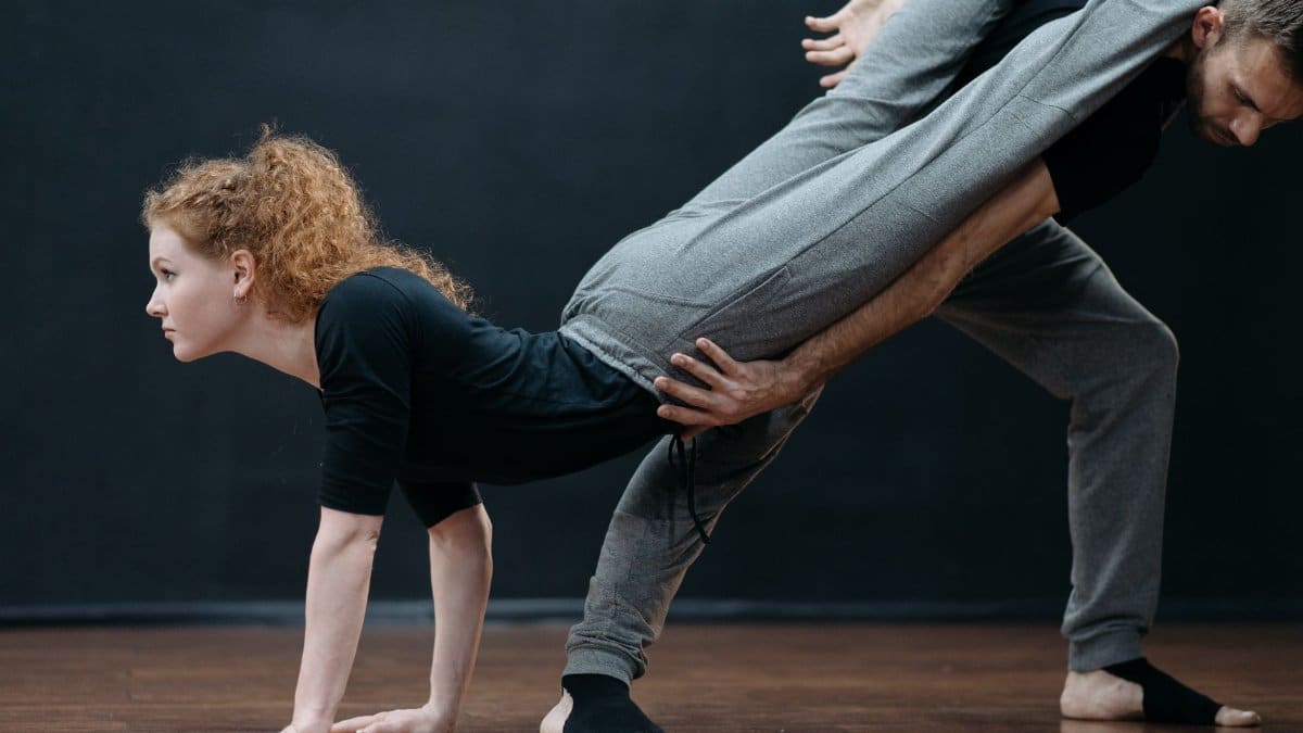 Ballet dancers showcasing flexibility and posture in studio performance practice.