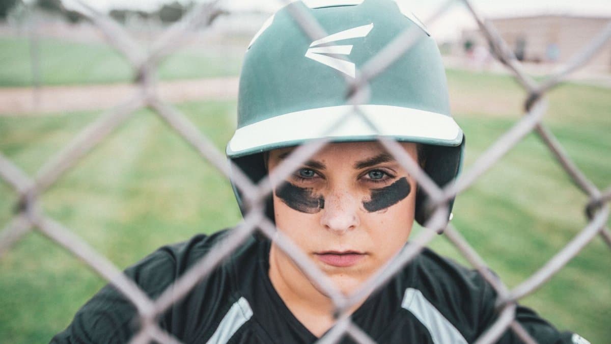 Close-up of a baseball player wearing a helmet, focused and ready.