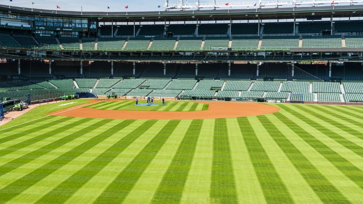 A vibrant view of Wrigley Field baseball stadium in Chicago on a sunny day.