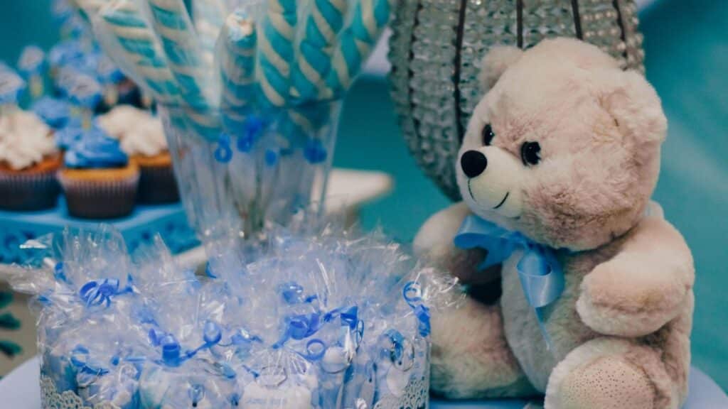 Charming setup for a baby shower with blue decorations and treats.