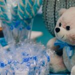 Charming setup for a baby shower with blue decorations and treats.