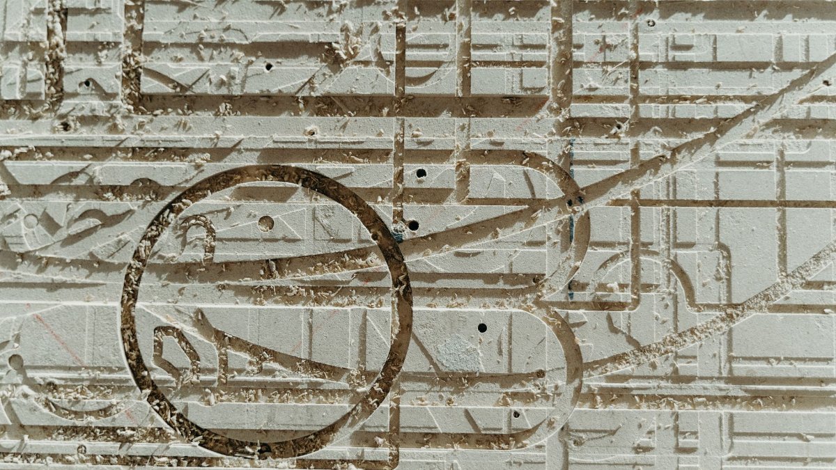 Abstract close-up of intricate carved texture on a surface, showcasing patterns and artistic details.