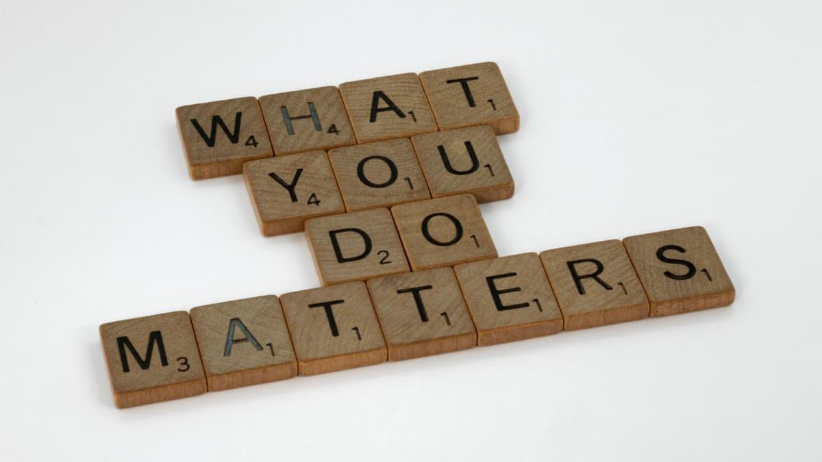Wooden letter tiles spelling 'What You Do Matters' on a neutral background.