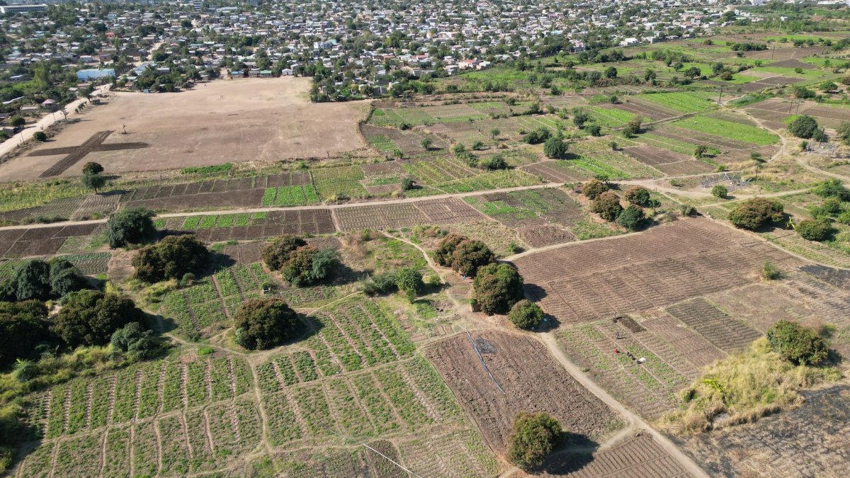 Expansive aerial view showcasing agricultural fields and rural landscape near Lilongwe, Malawi.