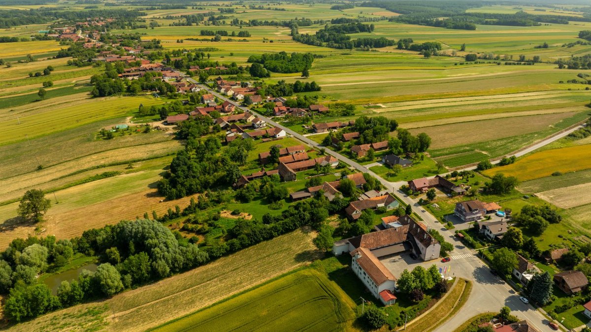 Scenic aerial view of Velika Trnovitica village and surrounding farmland in Croatia.