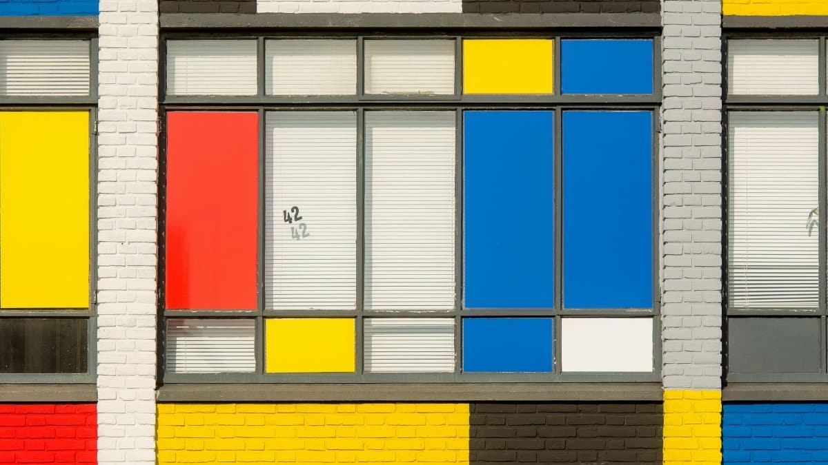 Bright and colorful building facade with geometric patterns and vivid primary colors.