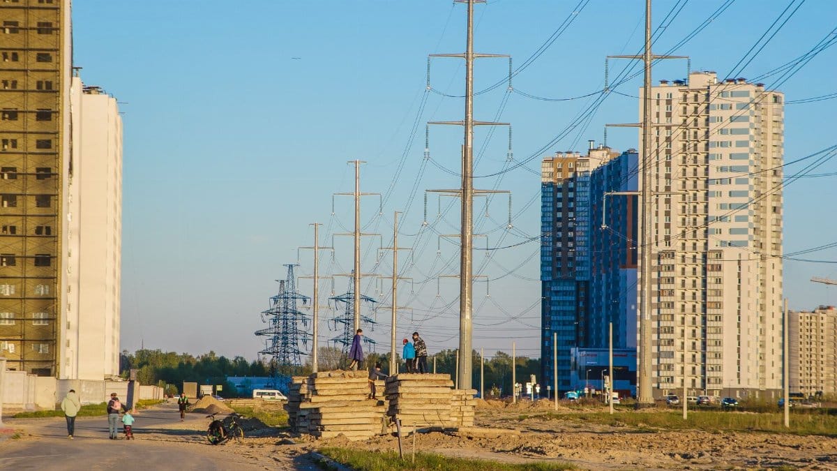 Urban view with high-rise buildings and power lines in daylight.