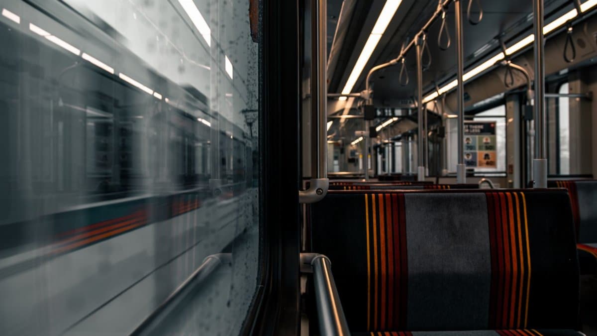Empty seats and motion blur capture the essence of a modern subway train interior in transit.
