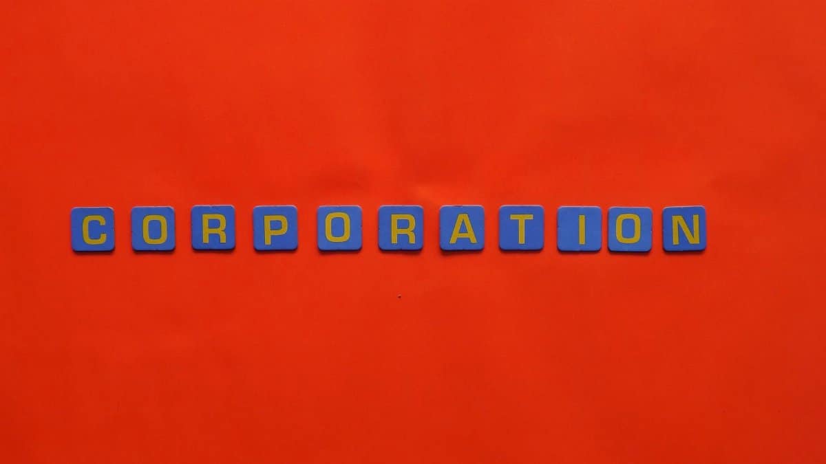 Blue tiles spelling 'corporation' on a bold red background, concept art.