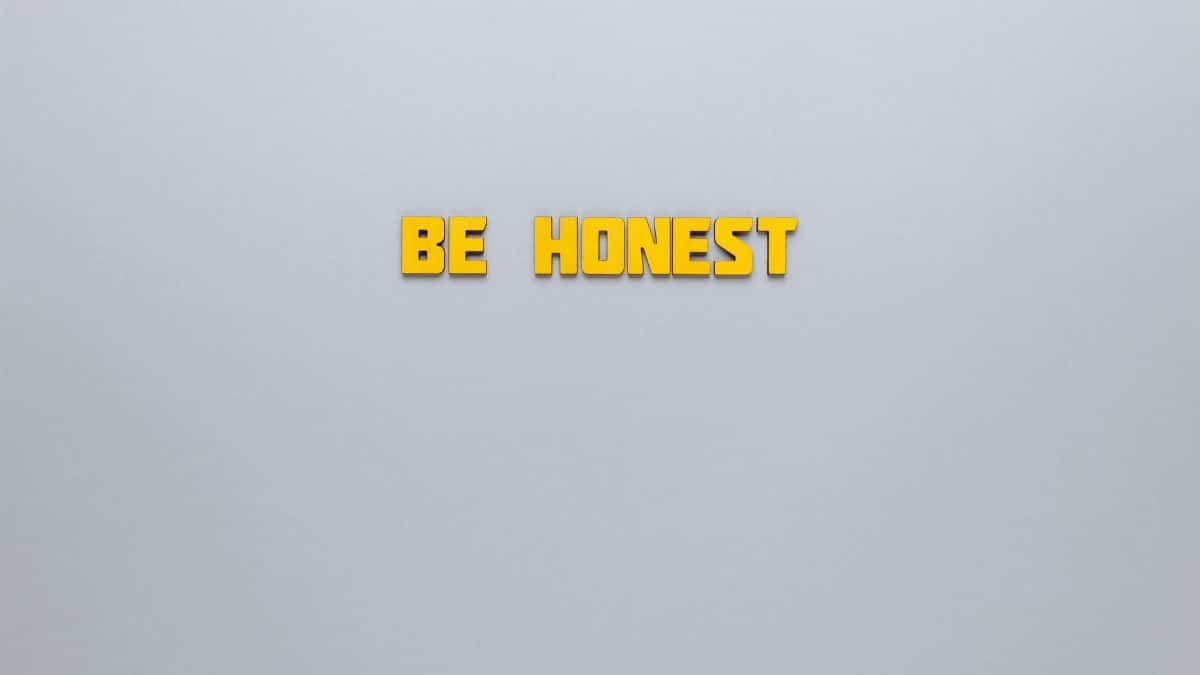 Simple yellow text 'Be Honest' on a neutral background, emphasizing clarity and inspiration.
