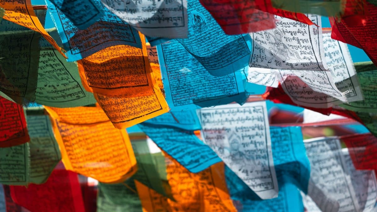 Vibrant Tibetan prayer flags flutter in the breeze, capturing cultural and spiritual essence.