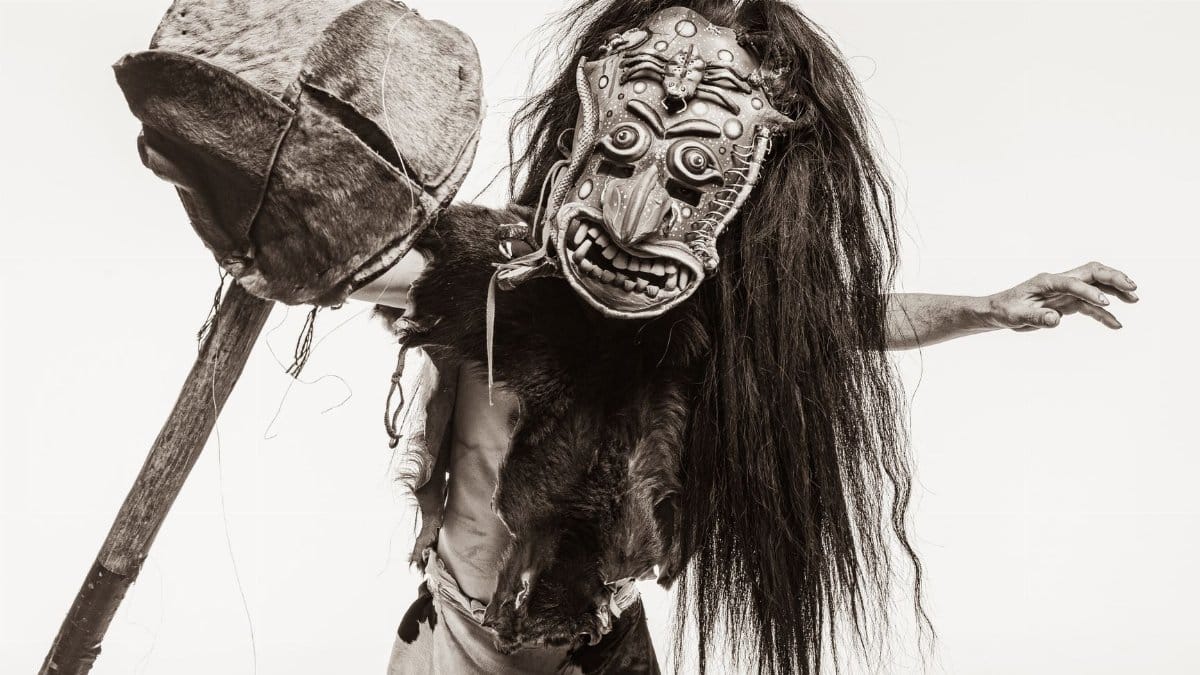 A striking portrait showcasing a traditional Mexican mask and attire, highlighting the richness of cultural traditions.